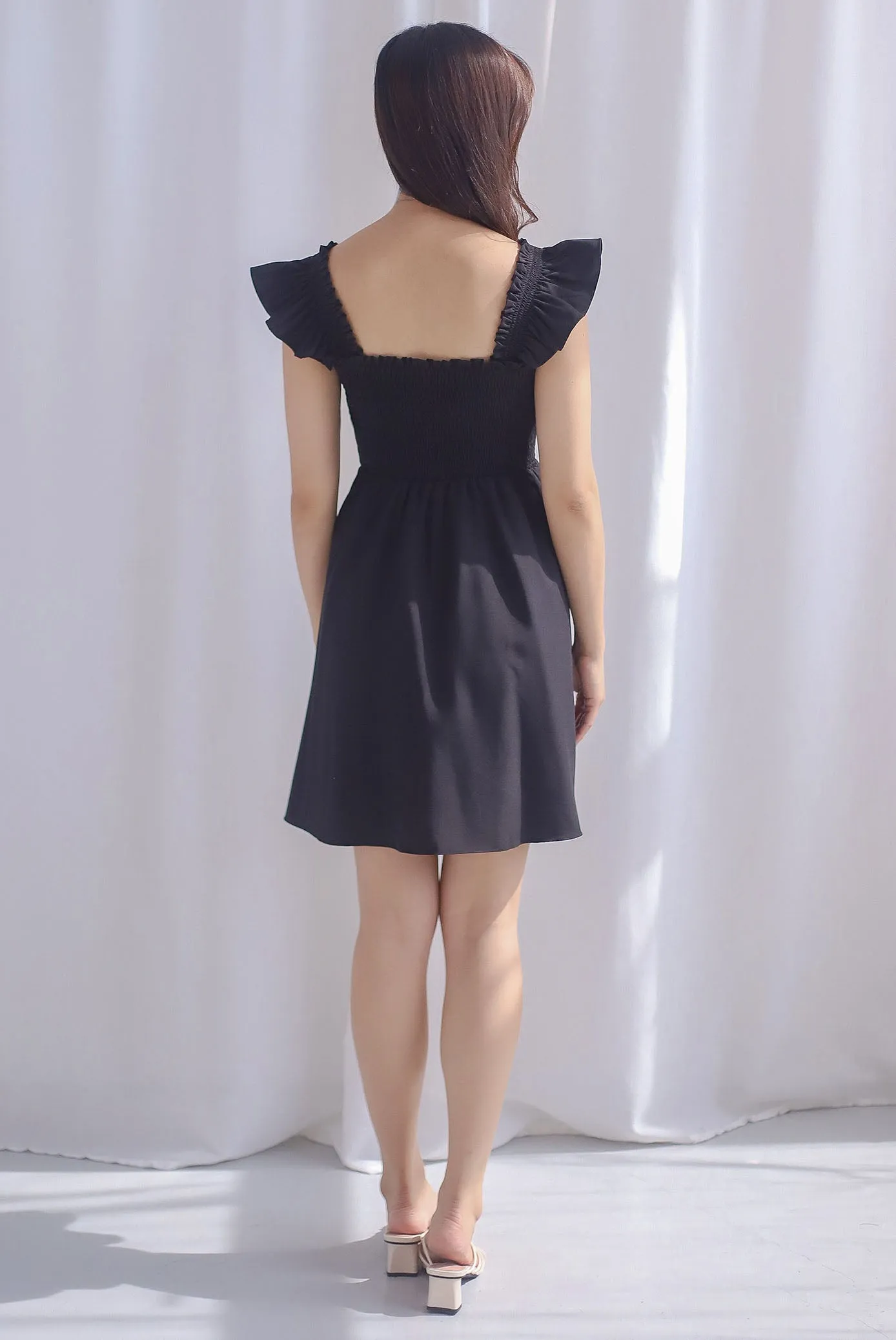 Shayna Smocked Ruffle Strap Romper Dress In Black