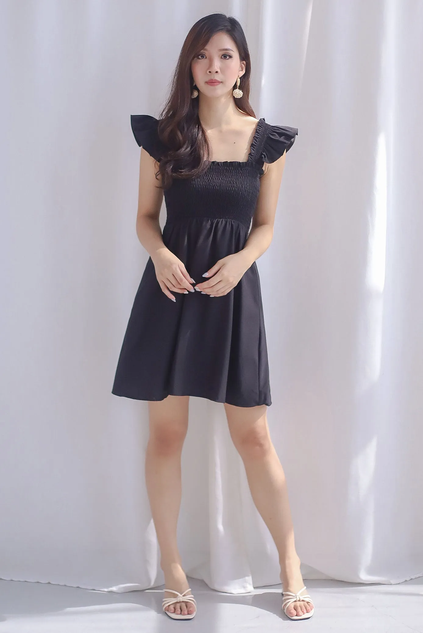 Shayna Smocked Ruffle Strap Romper Dress In Black