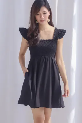 Shayna Smocked Ruffle Strap Romper Dress In Black