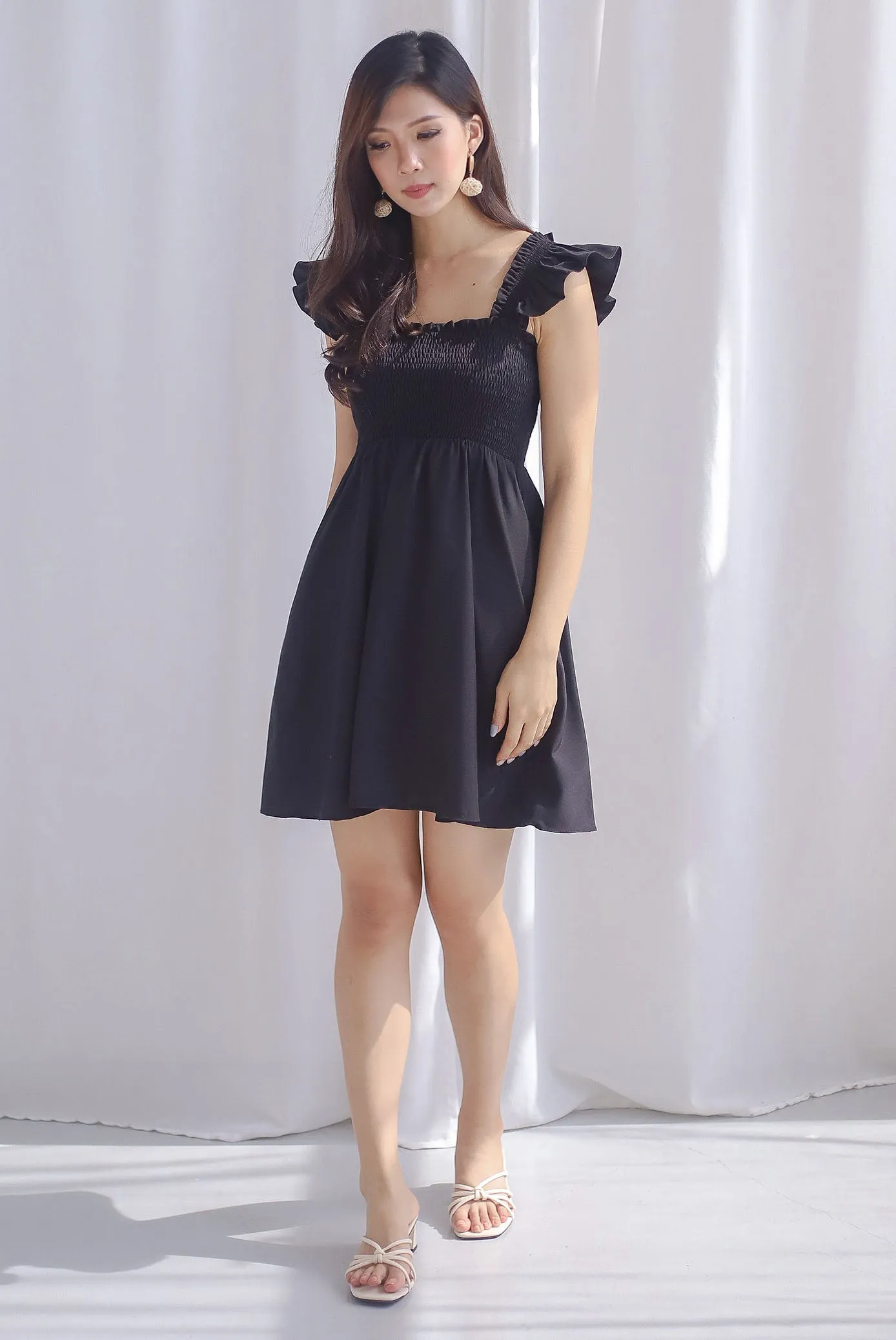 Shayna Smocked Ruffle Strap Romper Dress In Black