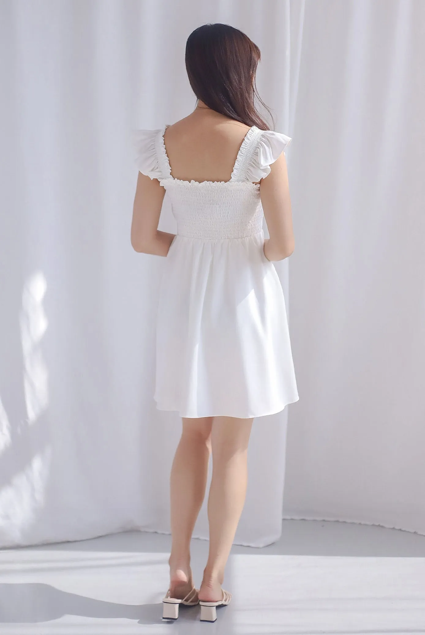 Shayna Smocked Ruffle Strap Romper Dress In White